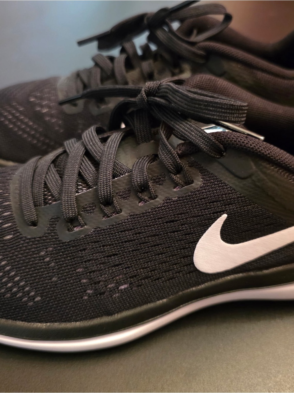 Nike Men’s Black Sneakers with White Swoosh